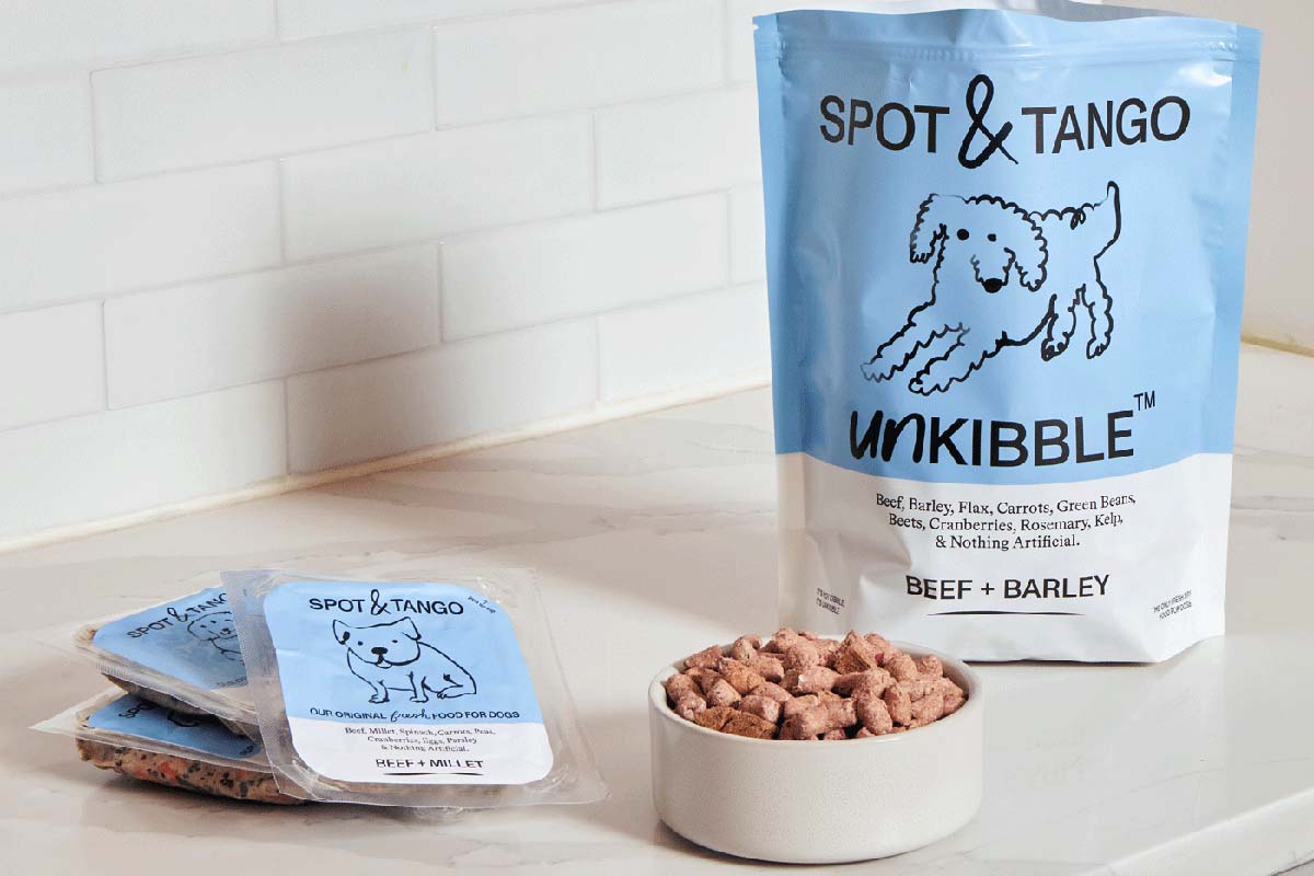 Spot & Tango UnKibble beef and barley fresh dry food with meal packs on a kitchen counter, ideal for active German Shepherds.